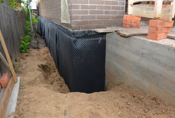 Happy homeowners after waterproofing job in Ridgeville